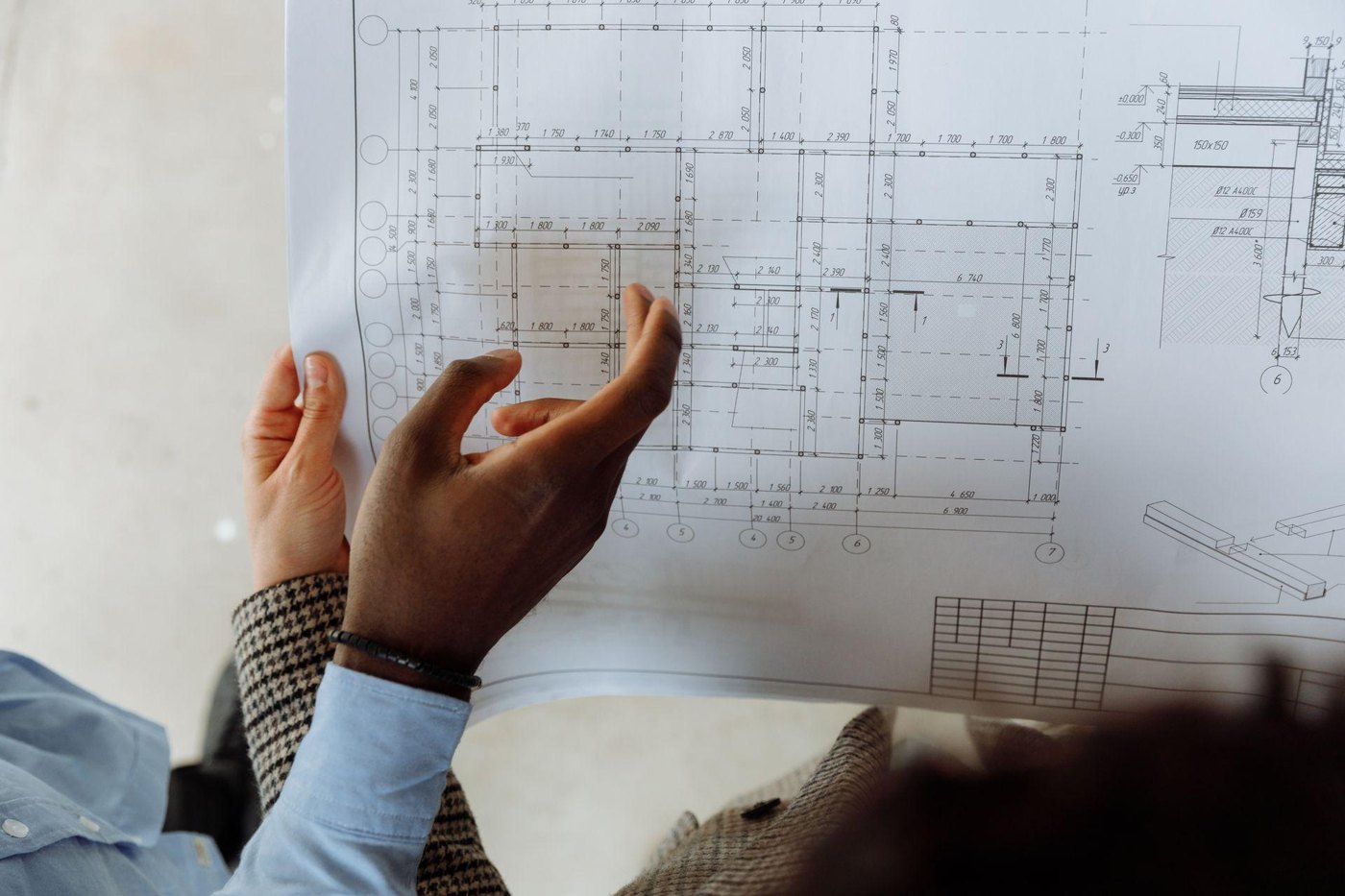 Reviewing dimensions and structural details on a printed drawing